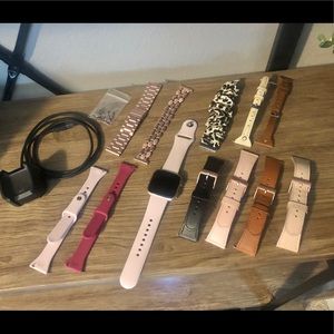 Rose Gold Fitbit Versa with 12 Bands!